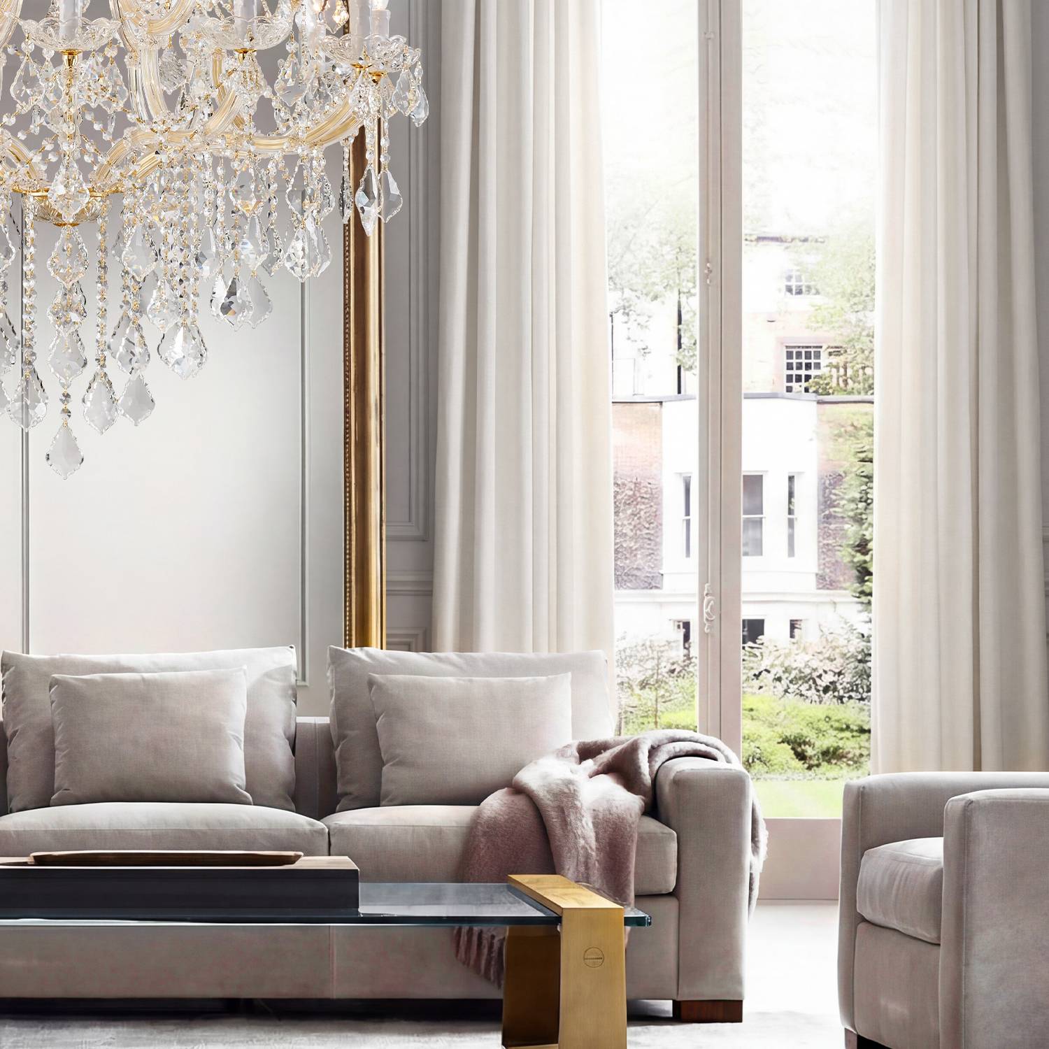 Maria Theresa crystal chandelier near high window and sofa