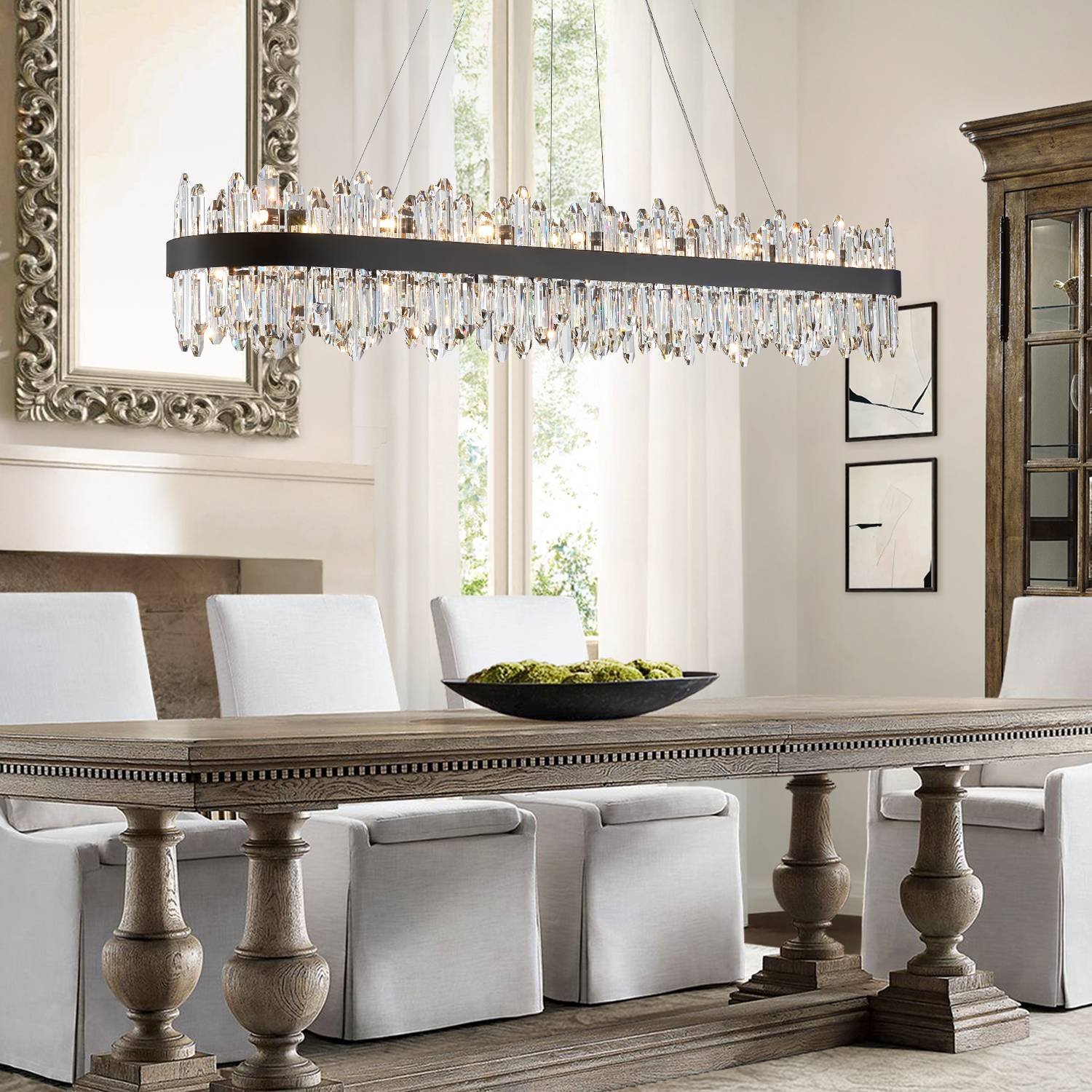 Black linear crystal chandelier over long dining table