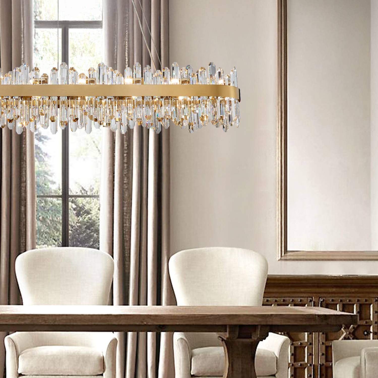 Gold rectangular crystal chandelier above dining chairs