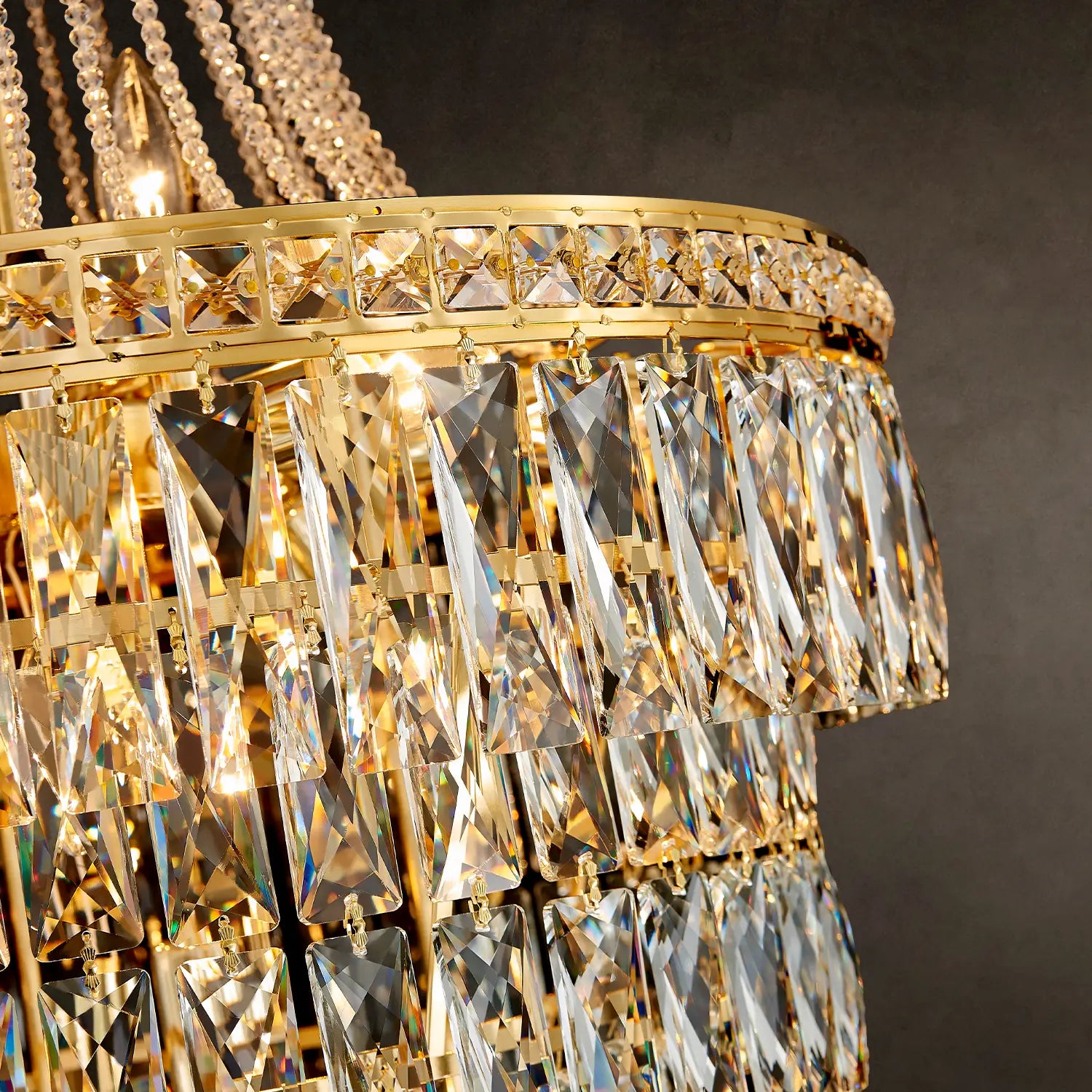 Close-up of gold frame and K9 crystal strands on chandelier