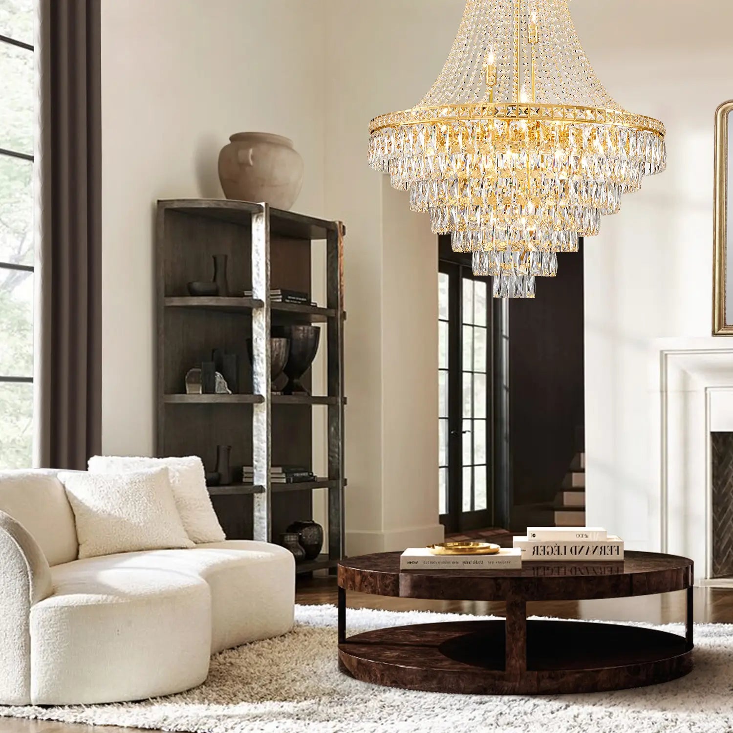 Large gold chandelier in high ceiling living room with fireplace