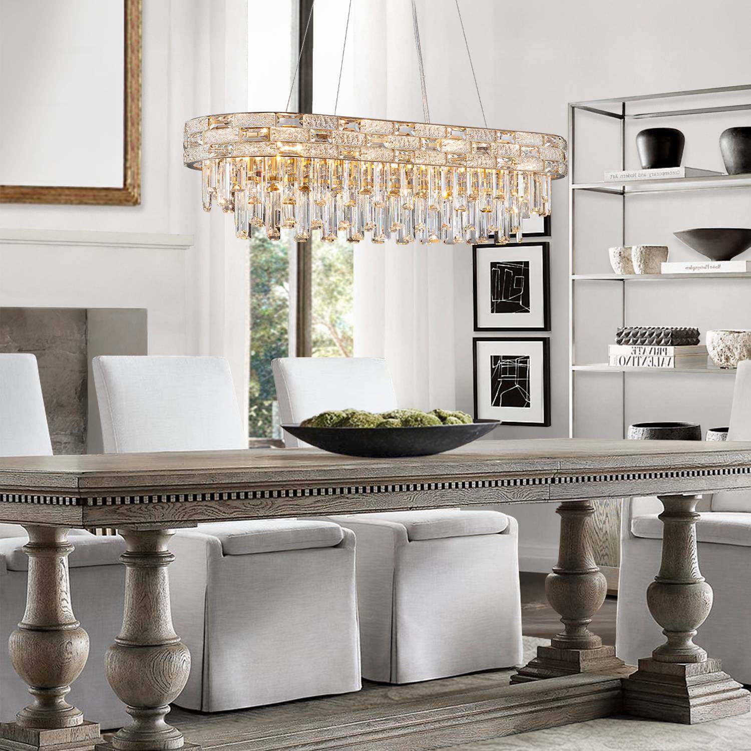 Oval gold chandelier above dining table