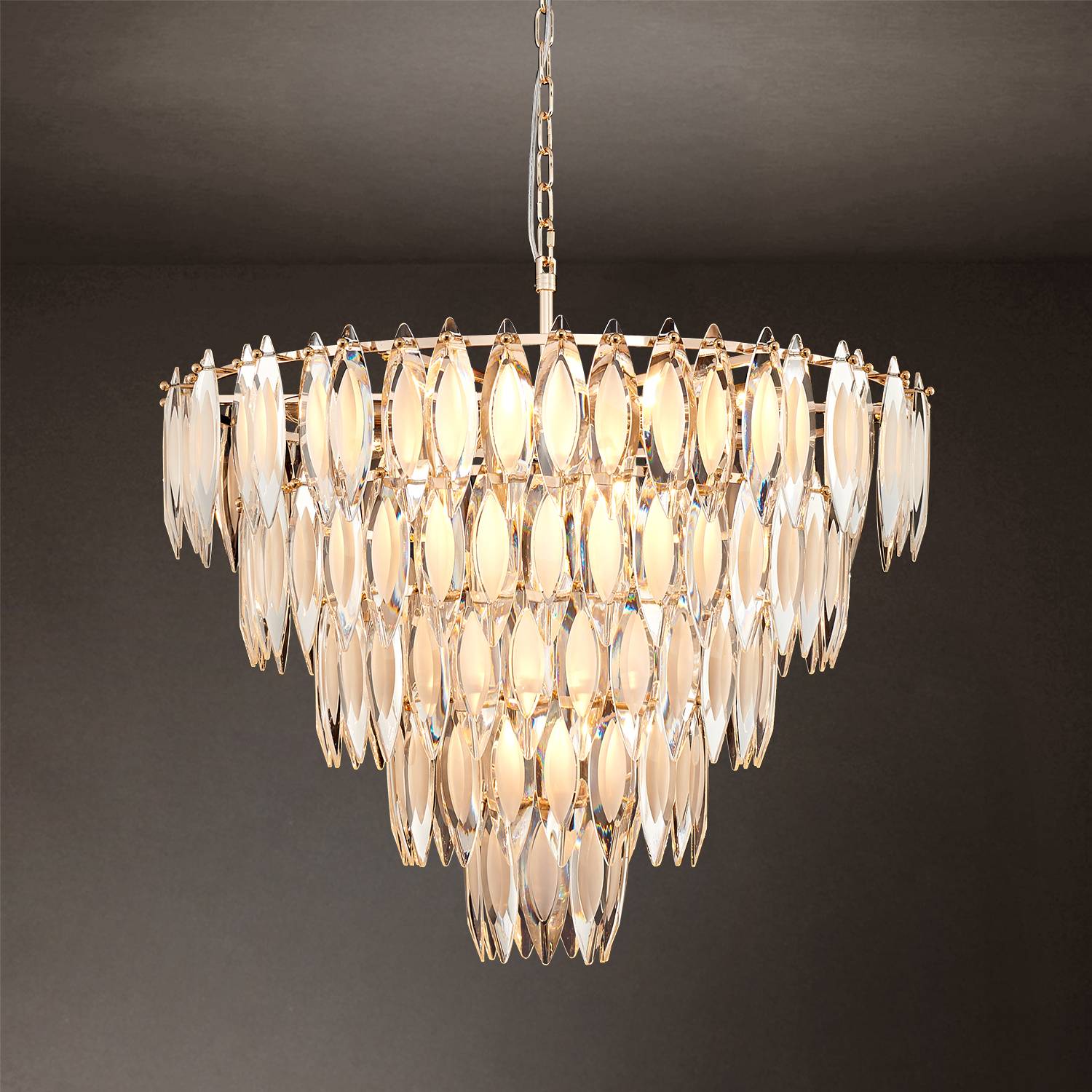 Round gold crystal chandelier hanging from chain