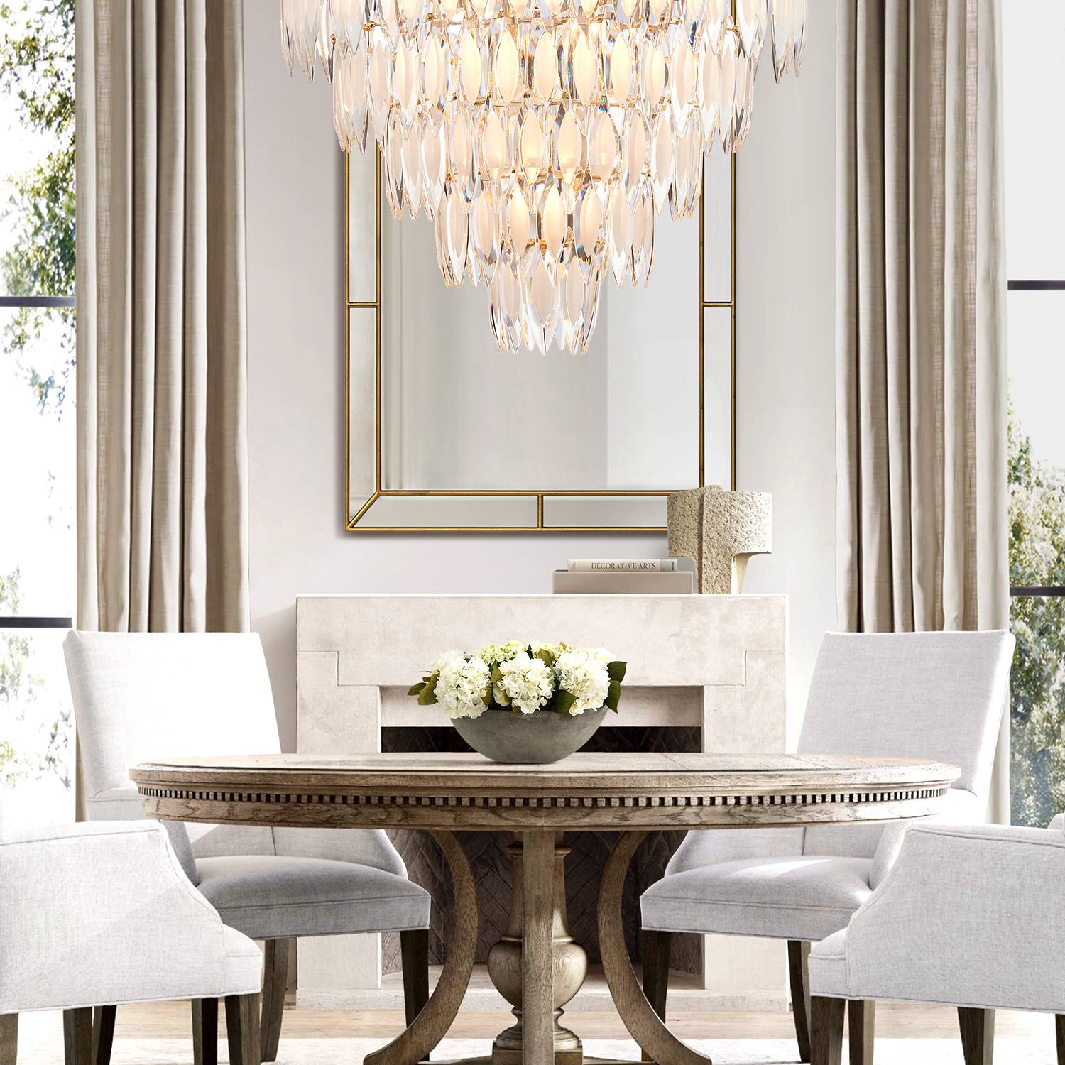 Round gold chandelier above dining table