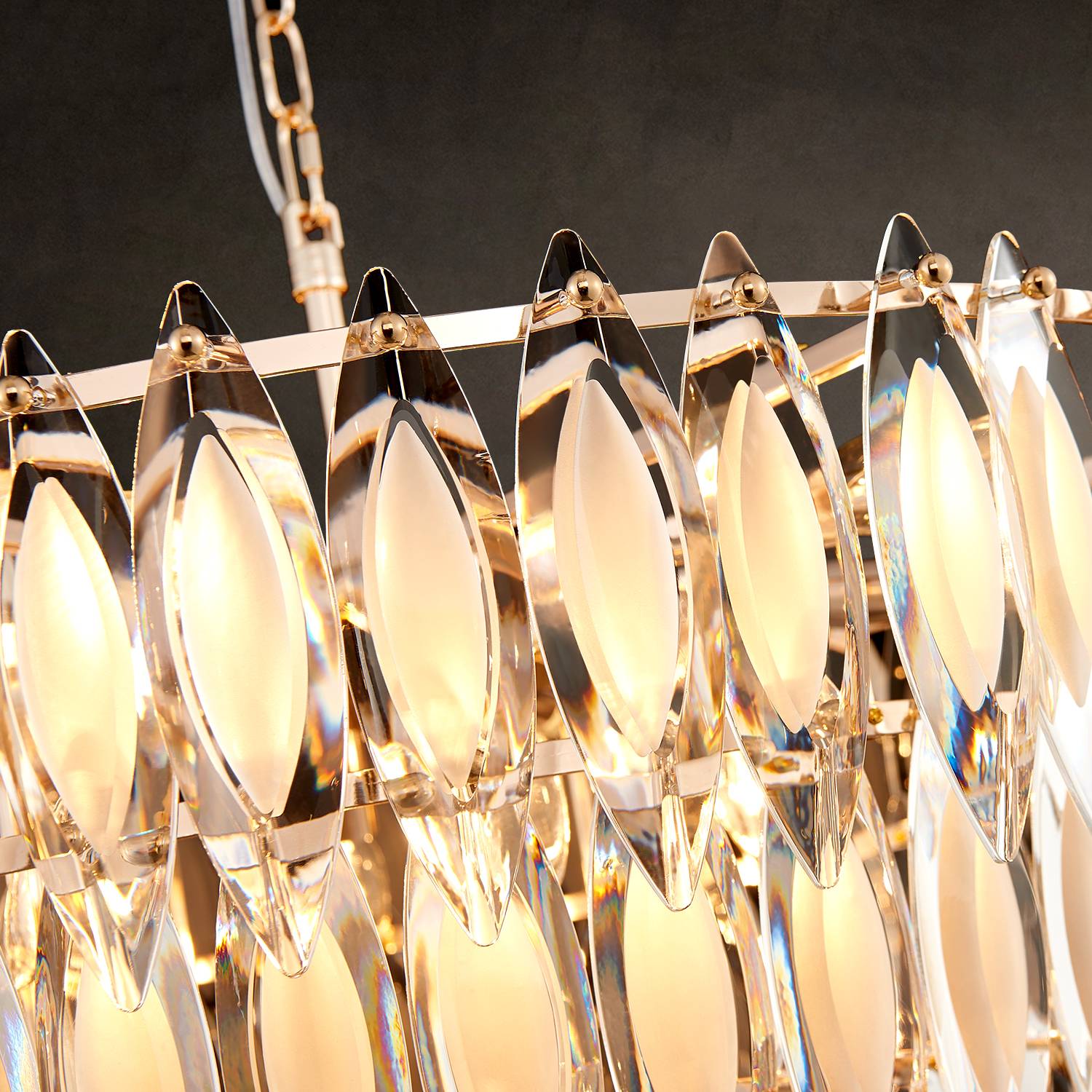 Close-up of gold frame and leaf-shaped K9 crystals on chandelier