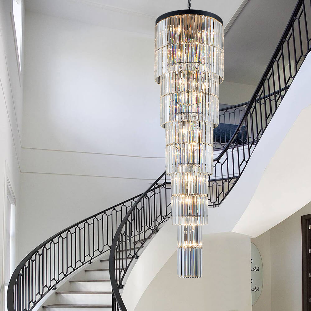 Long K9 crystal chandelier beside staircase railing