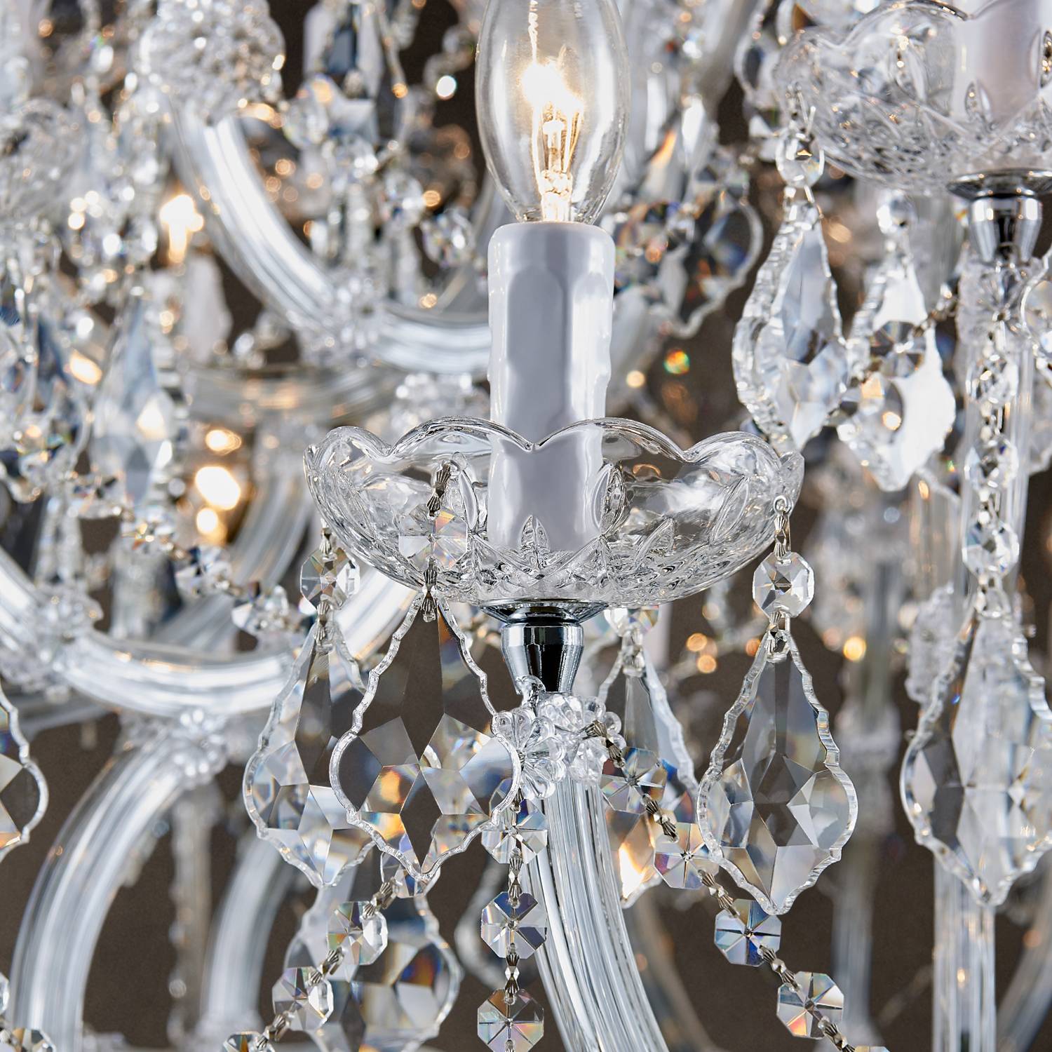Close-up of K9 crystal drops and candle socket on chandelier