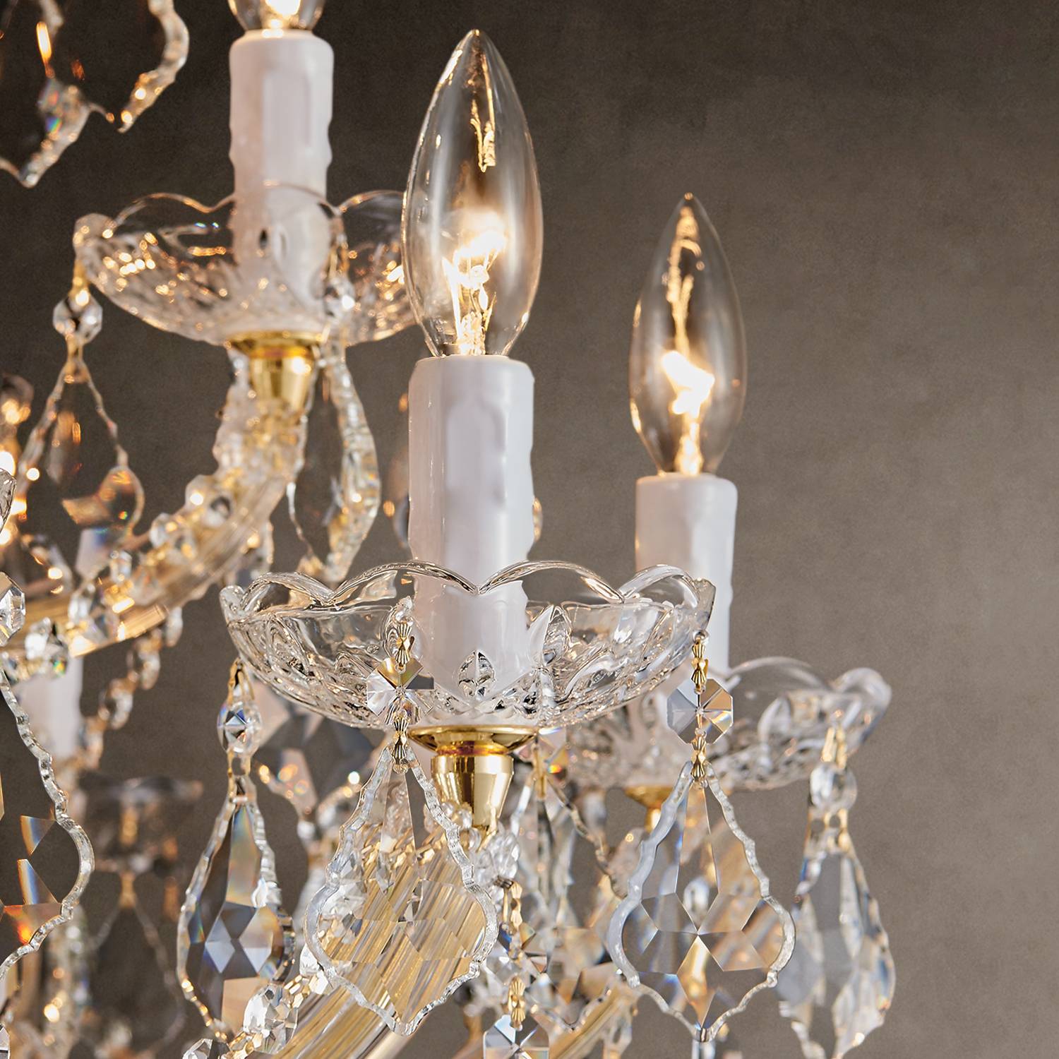 Close-up of gold frame and crystal arms on Maria Theresa chandelier