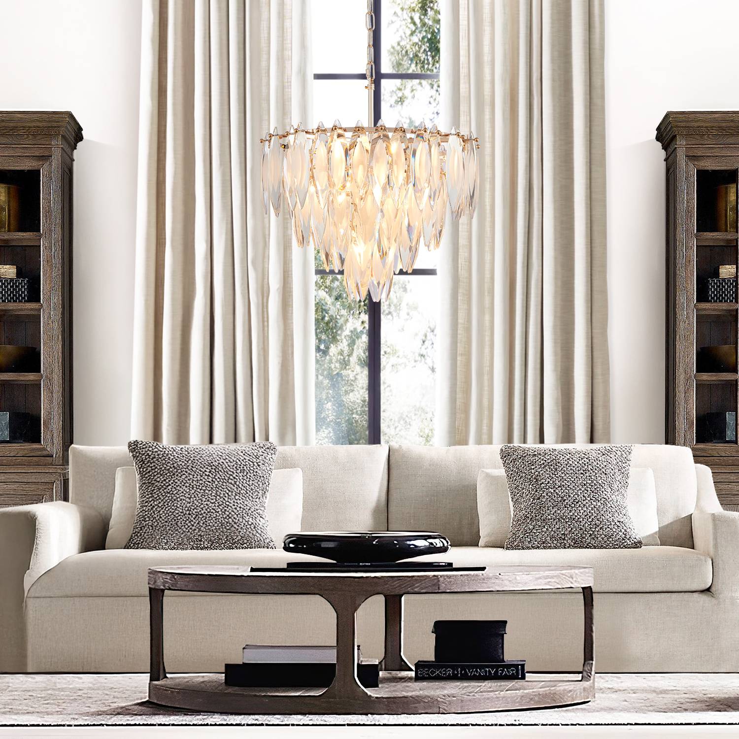 Gold multi-tier chandelier in living room with sofa