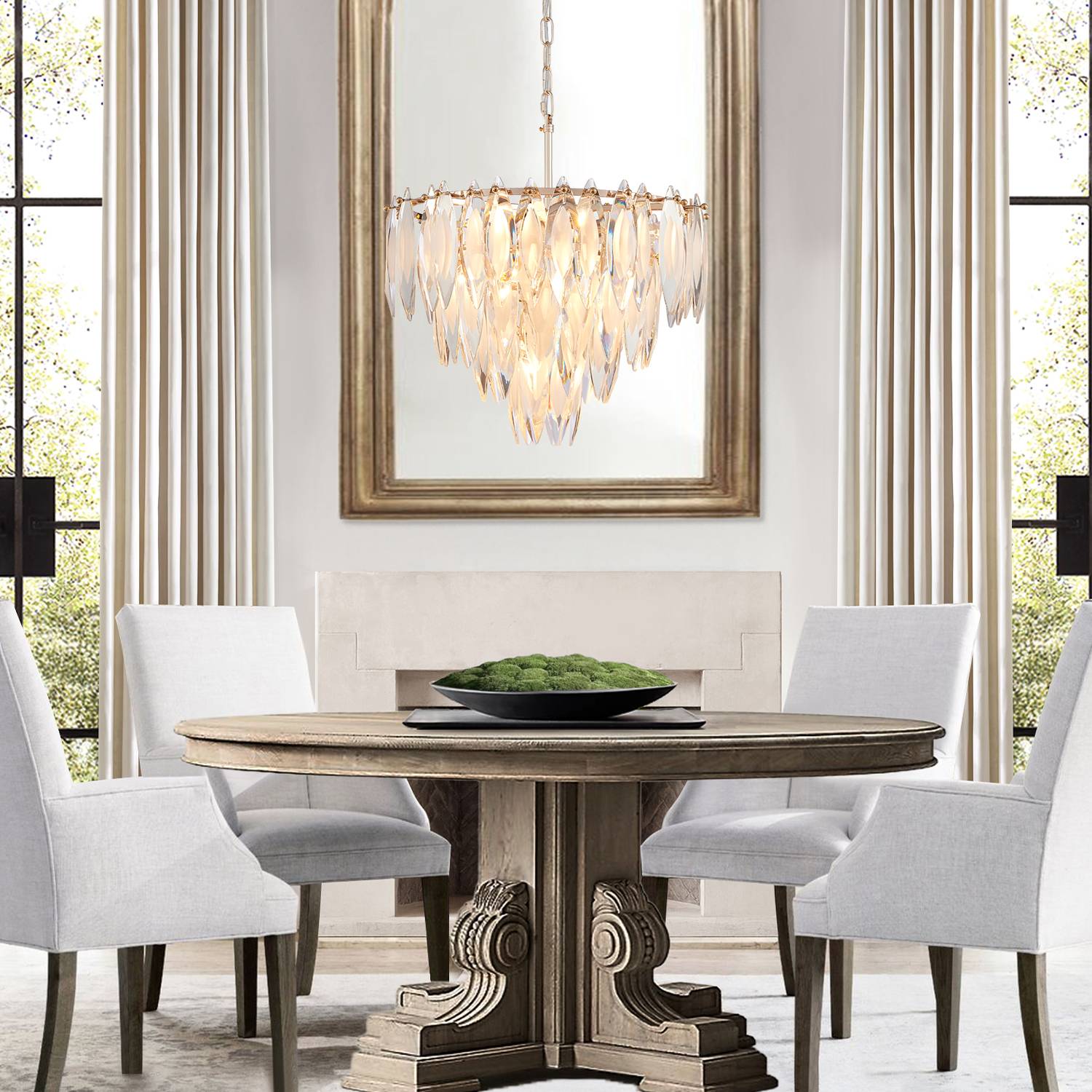 Round gold crystal chandelier above round dining table